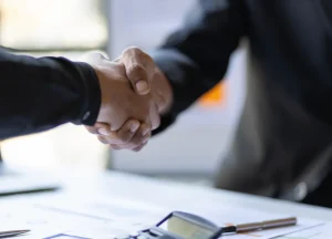 Private lender making a deal with a real estate investor on site