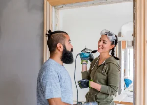 Fix and Flip Loan Requirements: What Lenders Really Look For 2 Couple renovating a house together, illustrating home improvement, rehab financing, and fix and flip loan projects