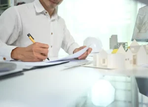 The Advantages of DSCR Loans for Real Estate Investors 2 Real estate investor reviewing property financials and rental income, illustrating DSCR loans and investment property cash flow