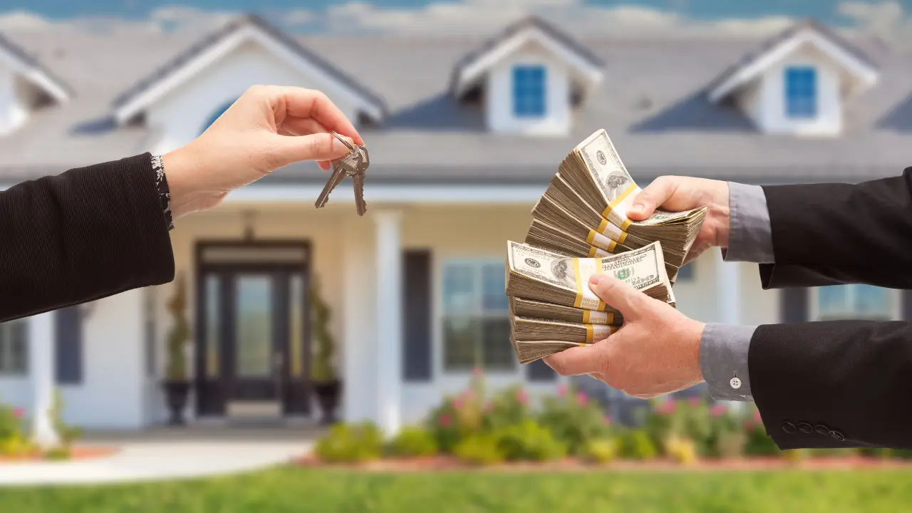 Real estate agent handing over house keys with stacks of money in front of a new house, representing real estate financing options and DSCR loans