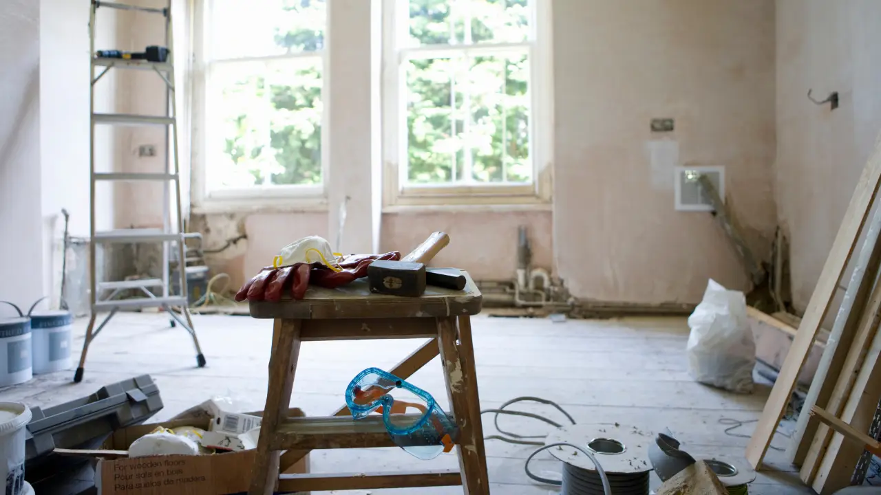 Wide shot of a windowed room under renovation, illustrating real estate investment and DSCR loan financing for fix and flip properties.